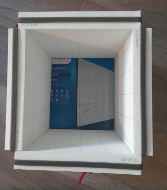 A view into the column, where one can see the upper piece of cardboard inside